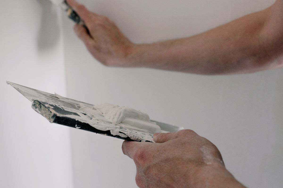 Smooth Wall vs. Textured Drywall Repair - drywall compound applied for a smooth repair
